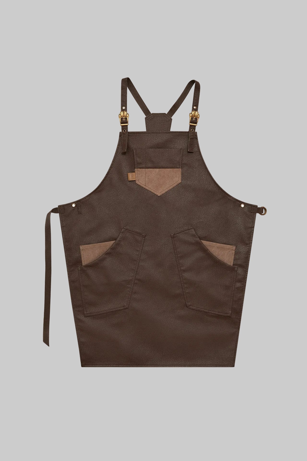 Brown apron with suspenders on a light gray background